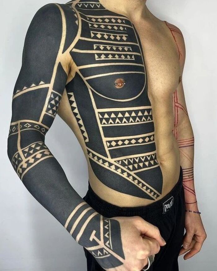 Blackout tribal armor tattoo for men 