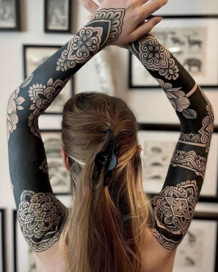 Blackout sleeves female tattoo