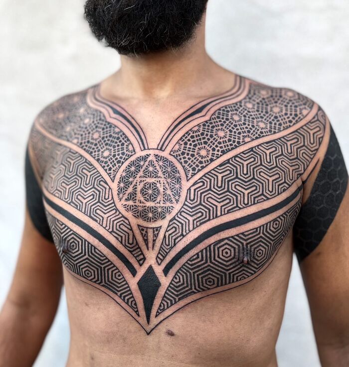 Chest and sternum blackout men tattoo