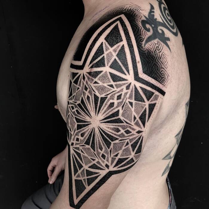Mandala blackout tattoo on shoulder 