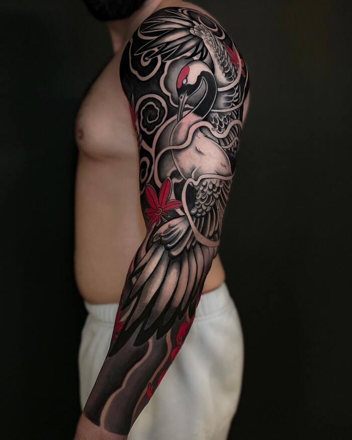 Blackout sleeve tattoo with color elements