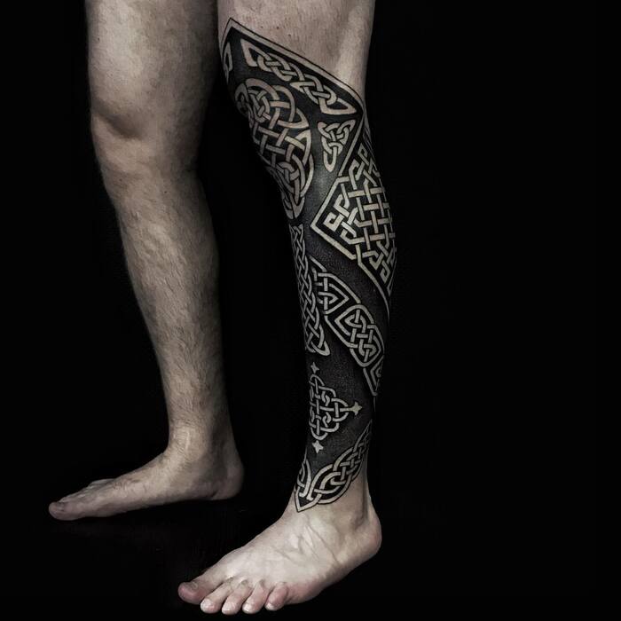 Blackout leg geometric tattoo