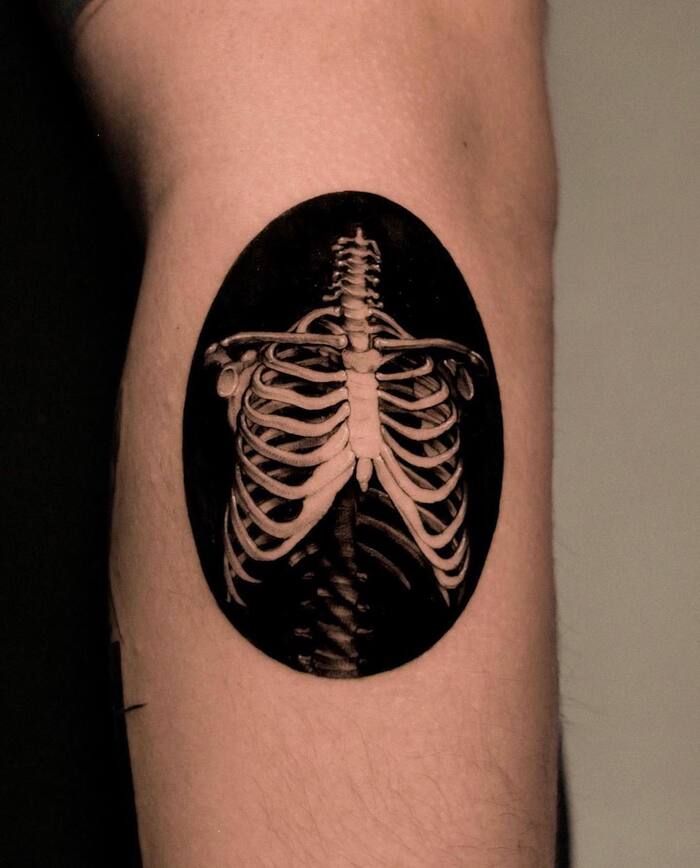 Small skeleton blackout tattoo