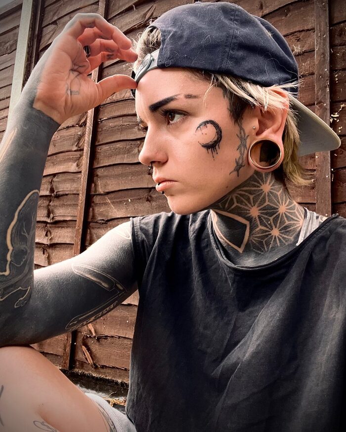 Female neck blackout geometric tattoo