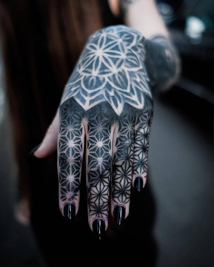 Mandala fingers blackout tattoo