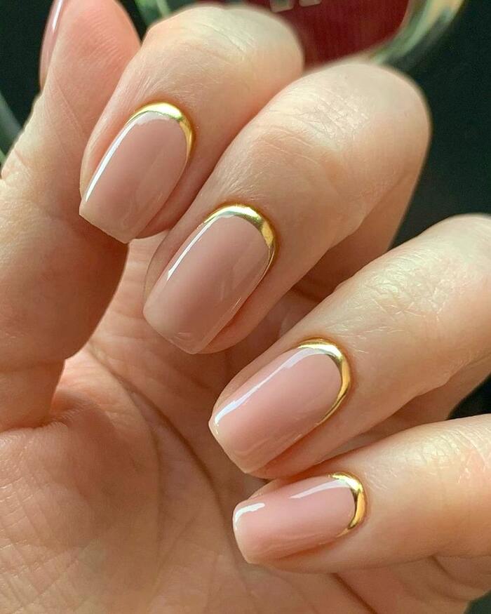 Simple neutral wedding nails with gold lunula accents