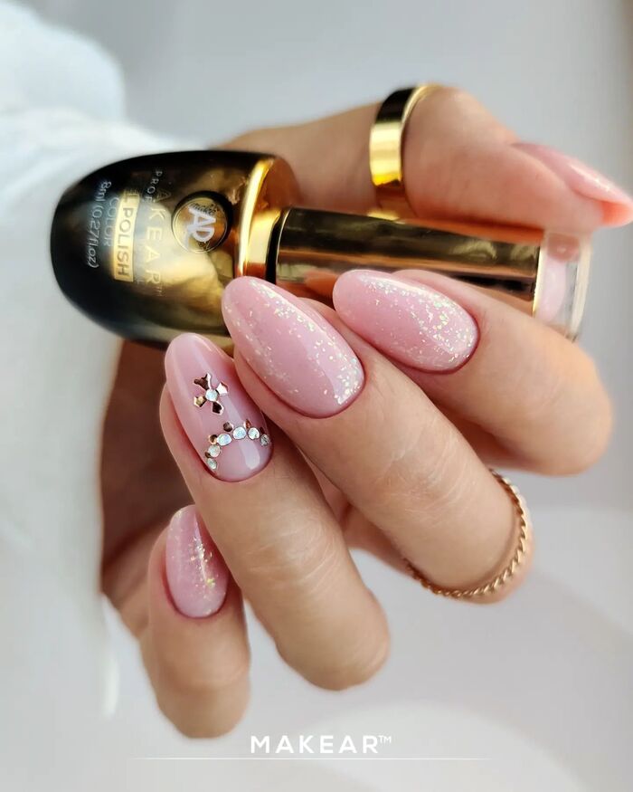 Soft pink wedding nail art with glitter