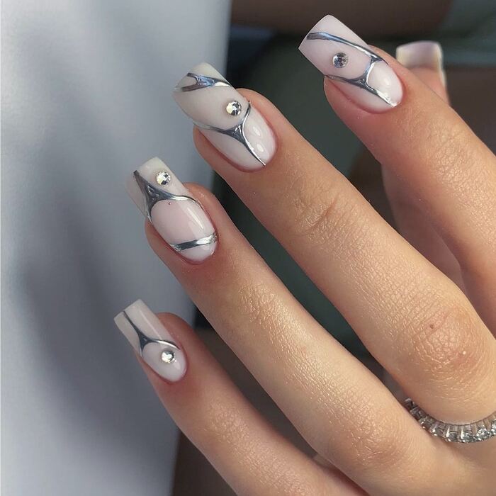 Milk white nails with silver dicorations