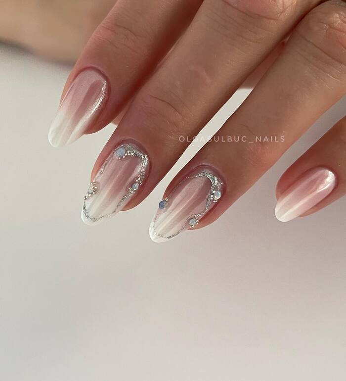 Pearl wedding nails with silver elements and diamonds