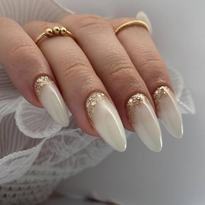 Classy white wedding nails with golden lunula