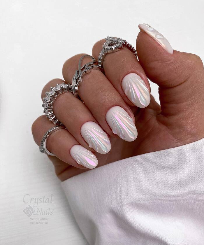 Short almond bridal nails with shell design
