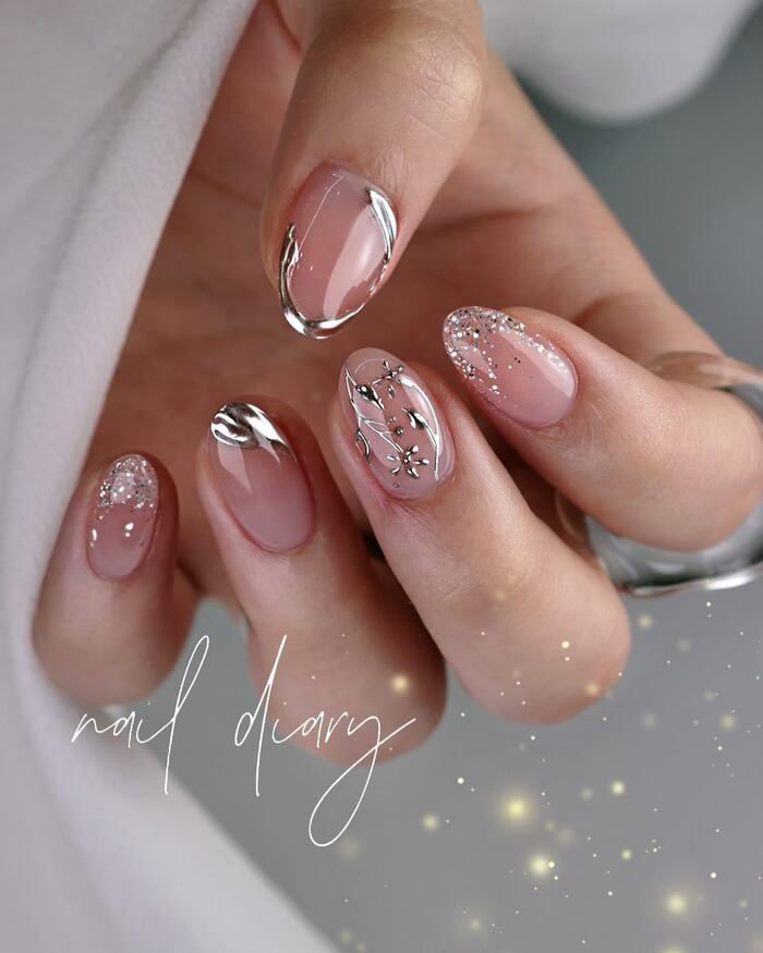 Neutral bridal manicure with silver decor elements