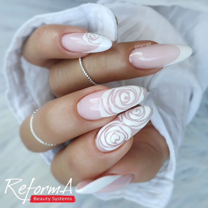 White wedding nails with french tips and rose paintings