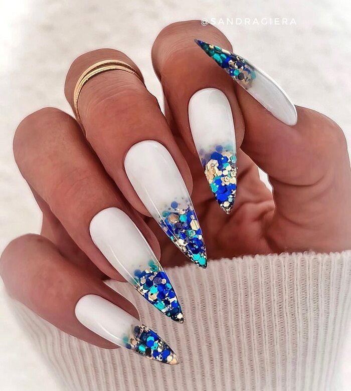 White bridal nails with royal blue glitter