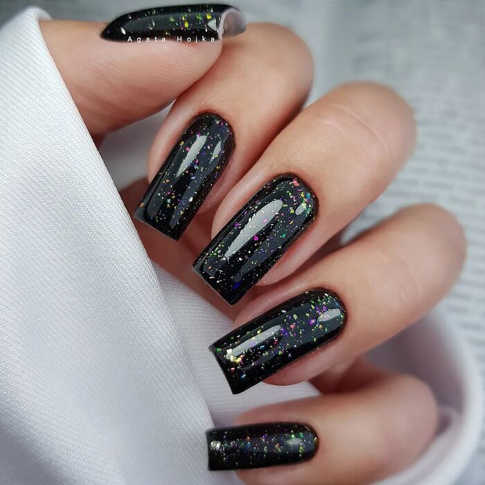 All black nails with sparkles