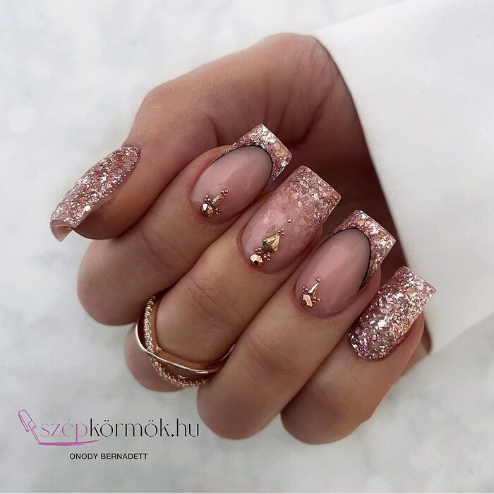 Beautiful wedding nail art in rose gold tone