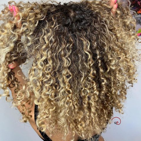 Brown curly hair with blonde highlights