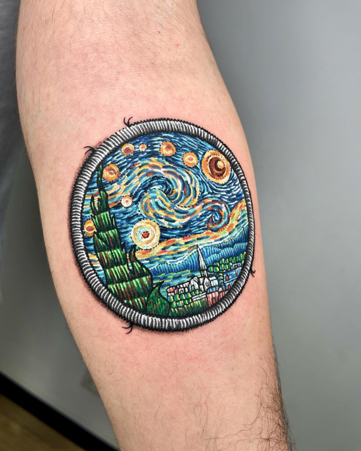 Patch-style embroidery tattoo with Van Gogh’s Starry Night