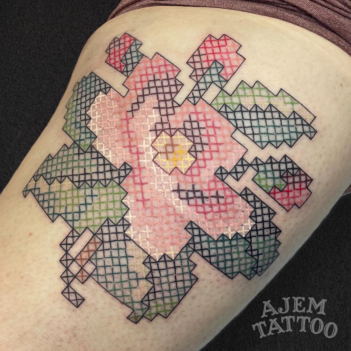 Large flower cross stitches tattoo 