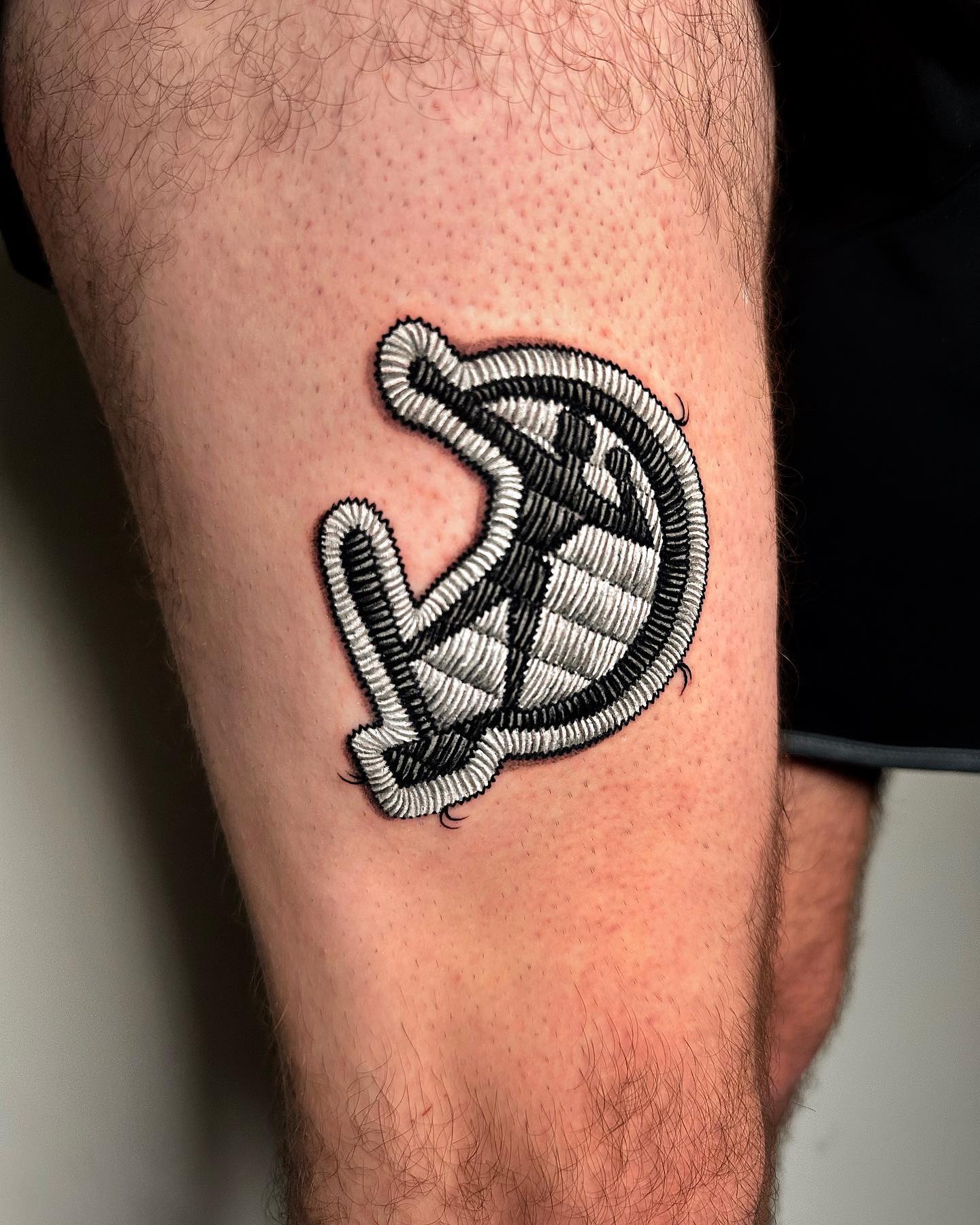 Black and white sickle and hammer patch tattoo