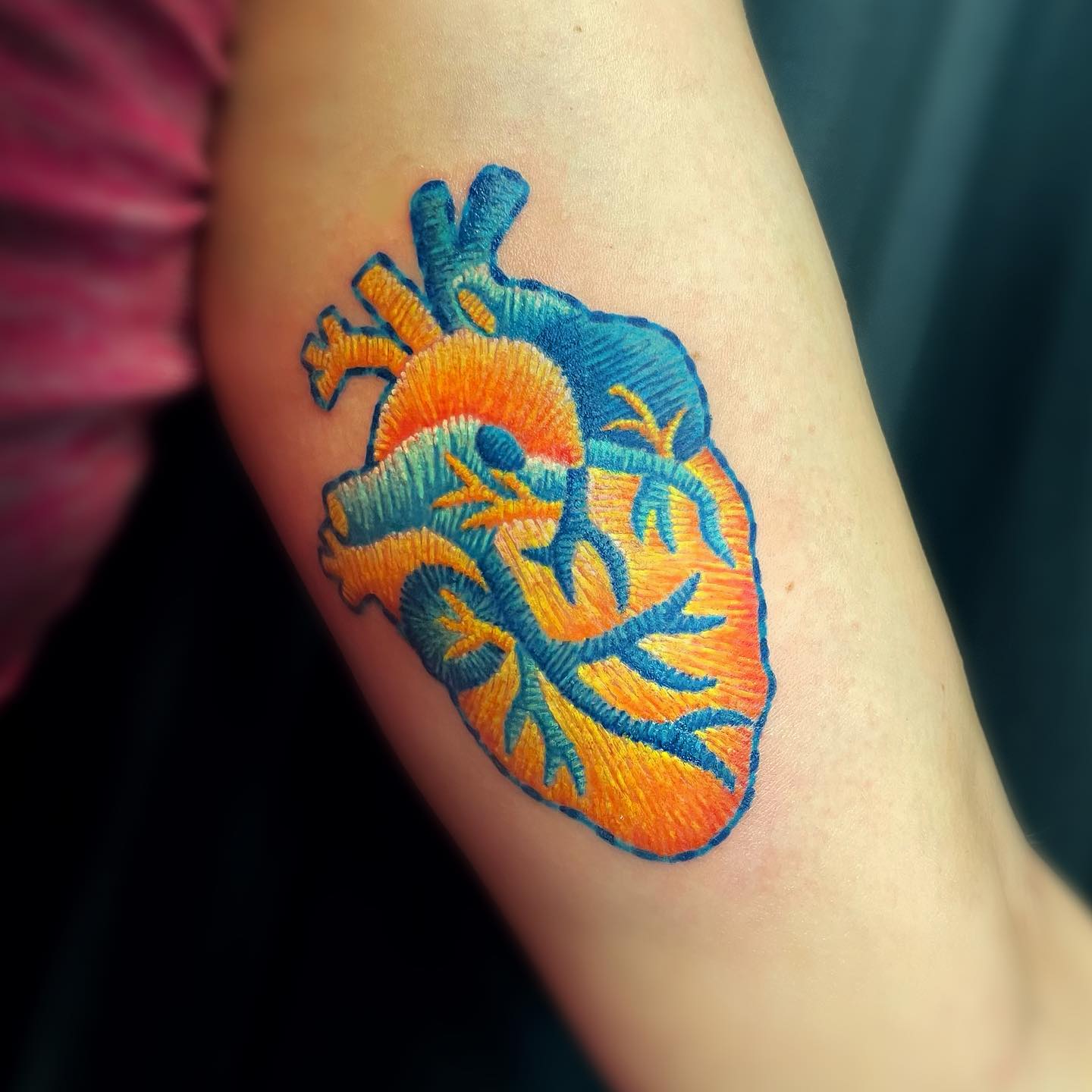 Realistic heart patch tattoo on arm