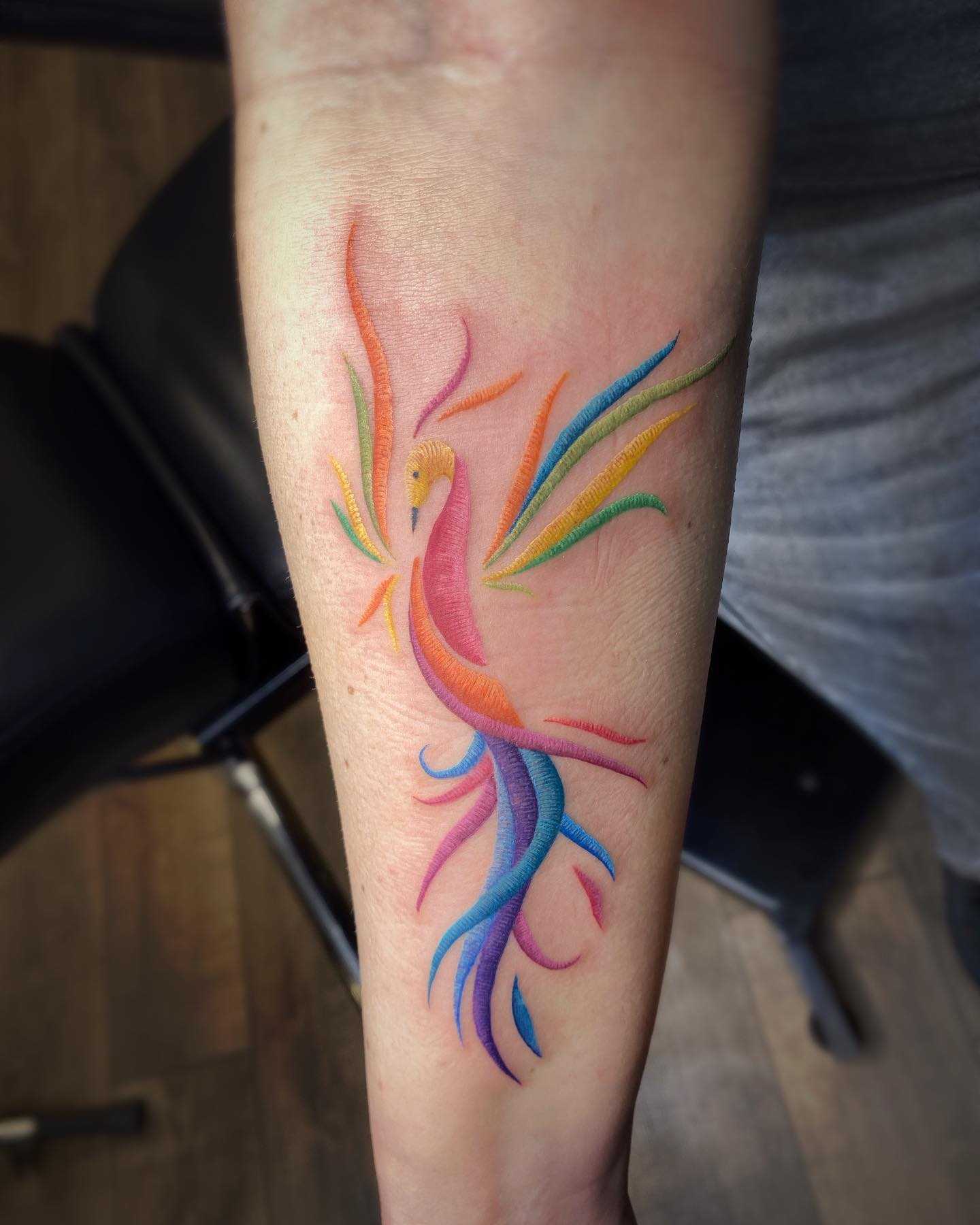 Abstract phoenix stitch tattoo on wrist
