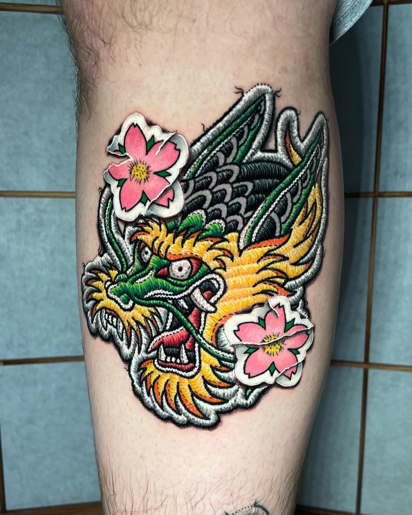 Traditional dragon stitch tattoo