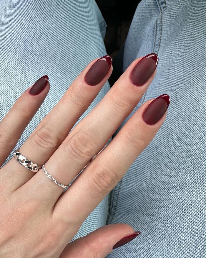Close-up photo of Matte Maroon Oval Nails With Glossy Tips