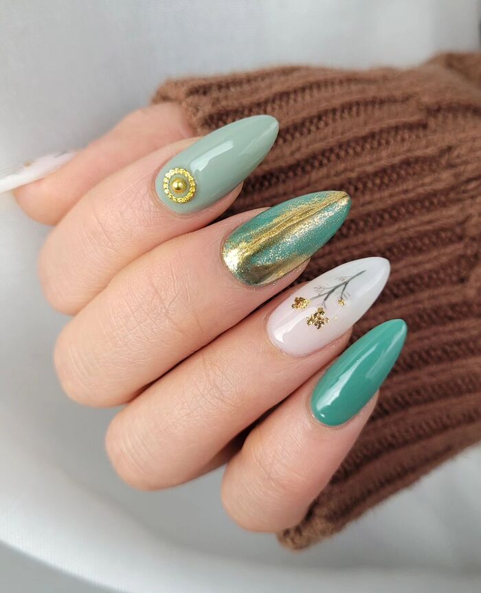 Close-up photo of Cute Green and Gold Fall Nails