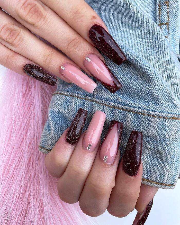 Close-up photo of Pink and Burgundy Coffin Nails With Sparkles