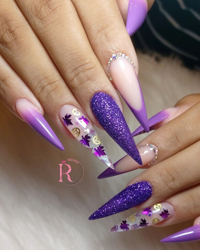 Close-up photo of Purple Fall Themed Stiletto Nails