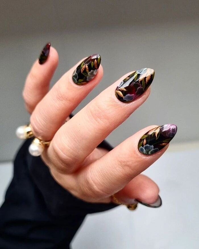 Close-up photo of Short Dark Nails With Fall Flowers