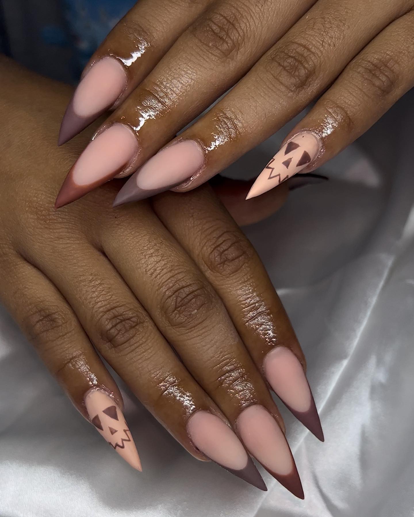 Brown French Tip Matte Stiletto Nails with Skull design on small finger nail
