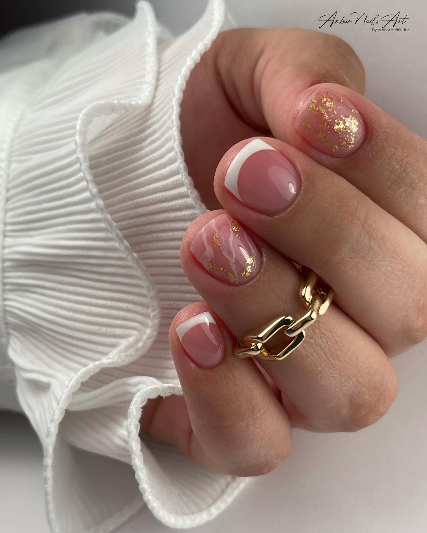 Very short White French Tip Nails with golden glitter