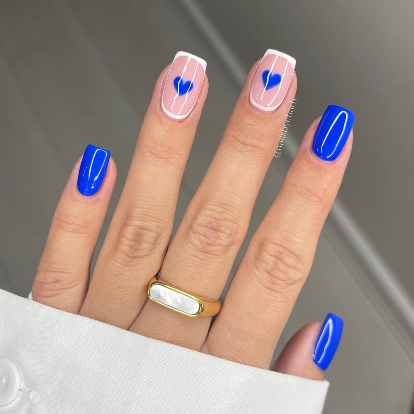 Blue And White French Tip Nails With blue hearts on center and ring nails