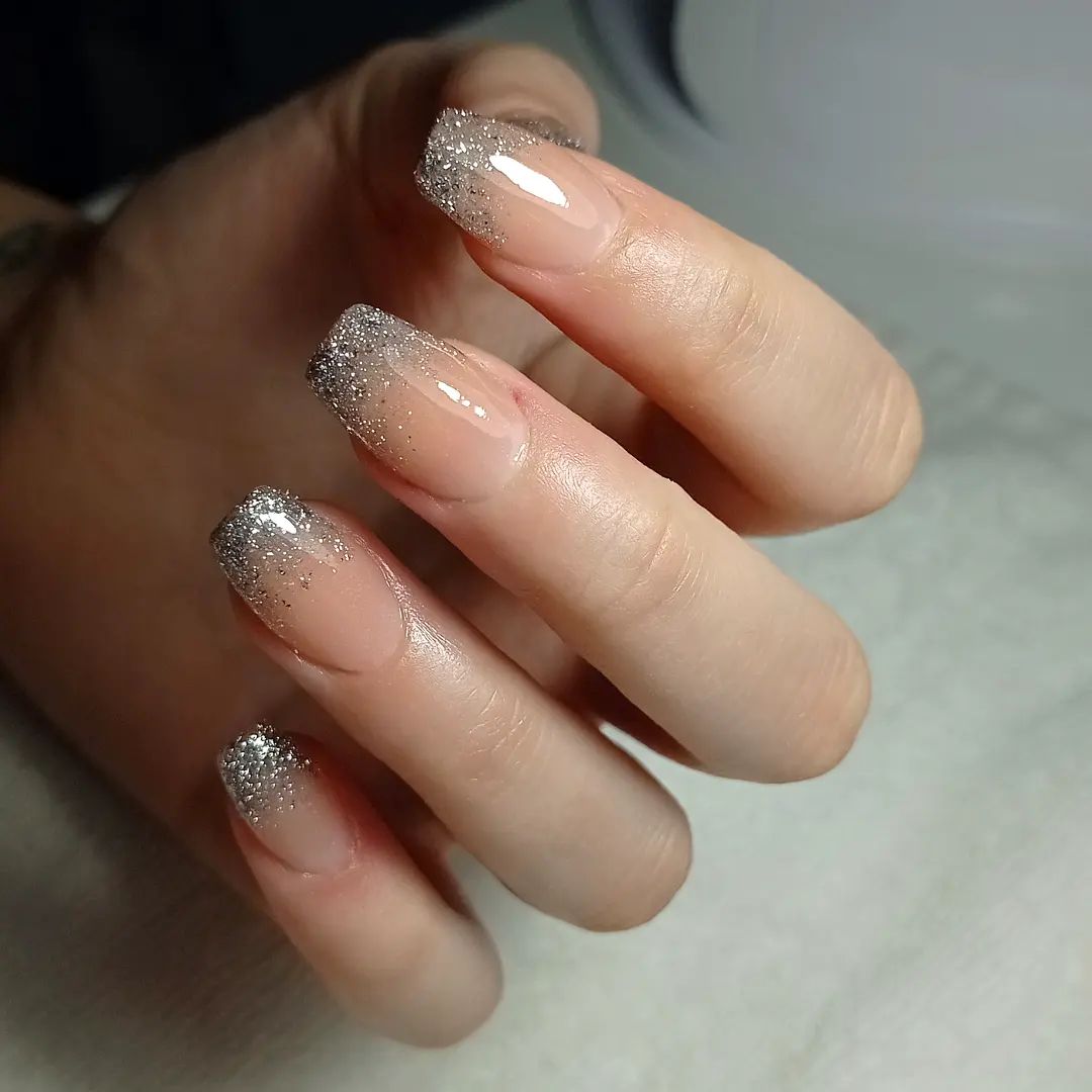 Natural nails with silver glitter on tips