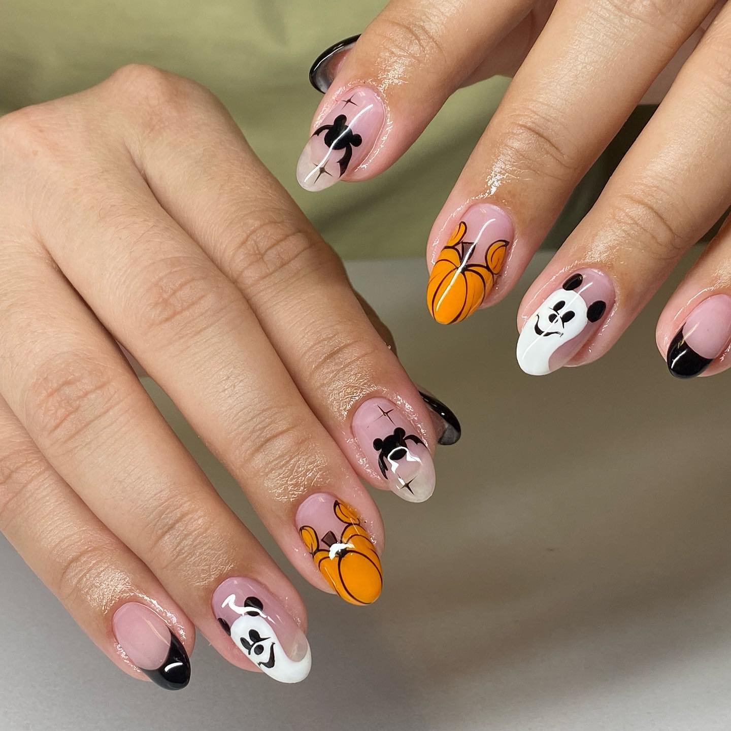 One more photo of Halloween nails with transparent base and ghost, bats and pumpkins drawings