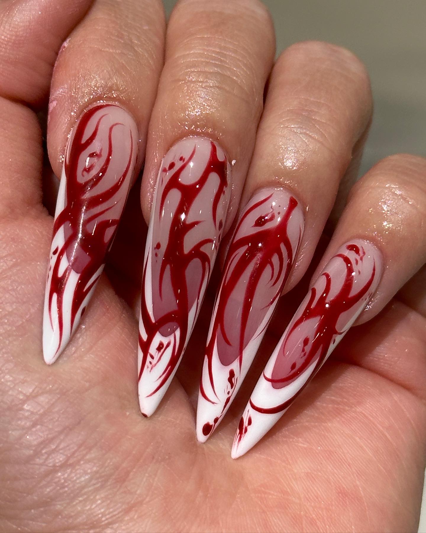 One more photo of long coffin or stiletto nails in combination of red gel polish with black or white