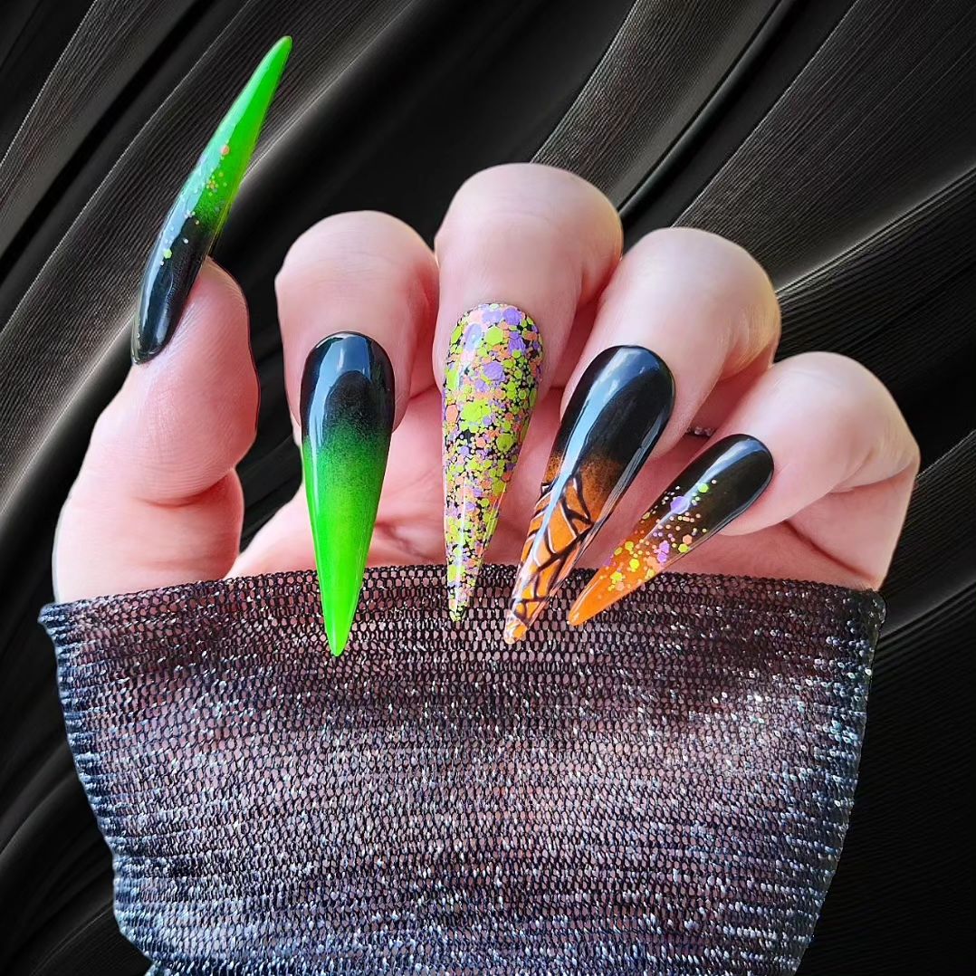 One more photo of Halloween manicure with creepy or neutral designs on long stiletto shape