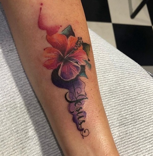 watercolor hibiscus tattoo on arm