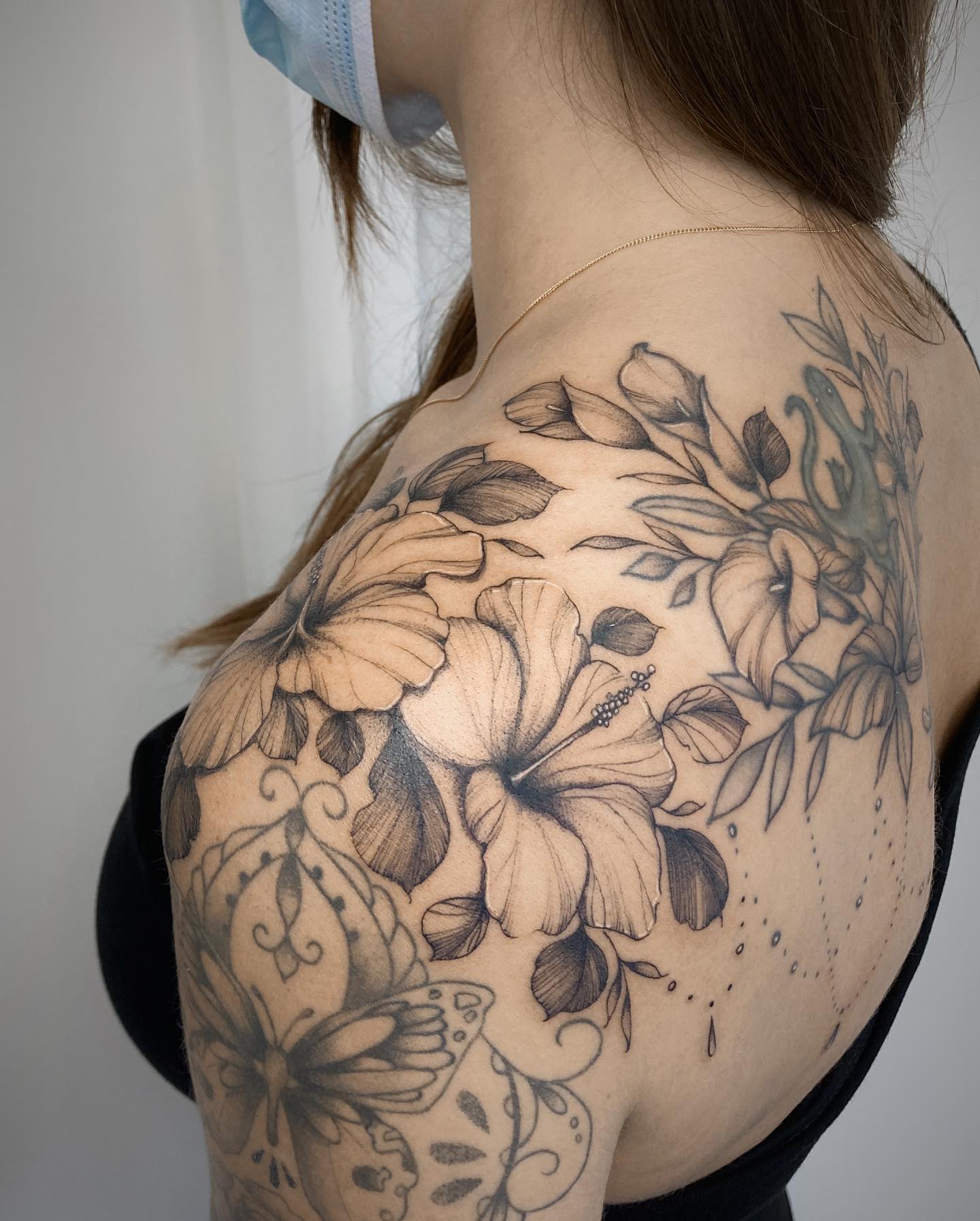 hawaiian flowers shoulder tattoo