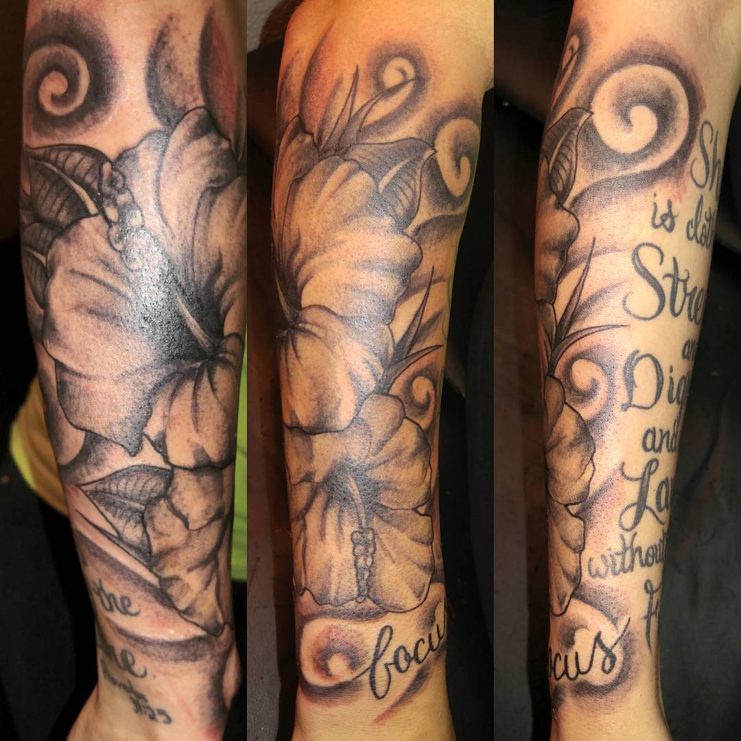 black and gray hibiscus sleeve tattoos