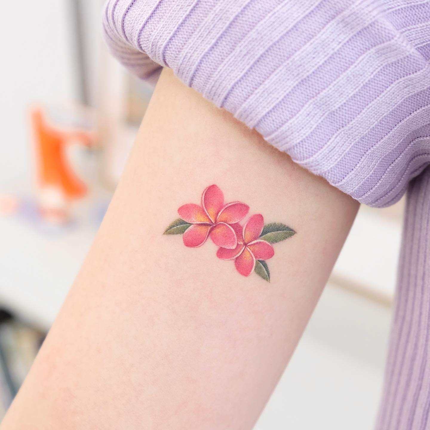 plumeria flower tattoo hip