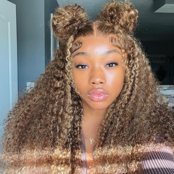 Curly honey blonde locs with two buns