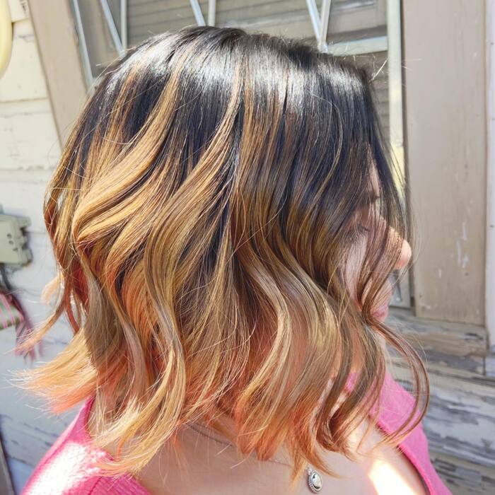 Honey blonde bob with dark roots side view