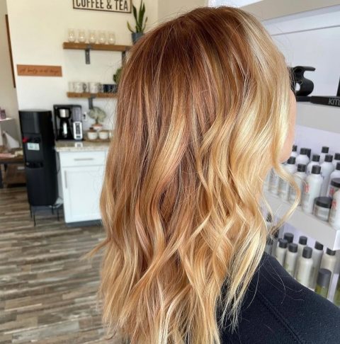 Long feathered strawberry blonde cut