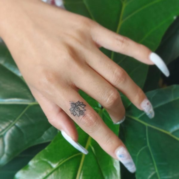 Finger Lotus Flower Tattoo