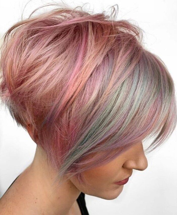 Photo of Woman With Long Pixie Bob In Pastel Tones