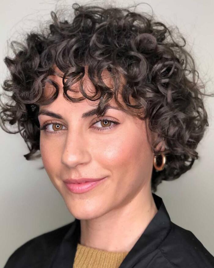 Photo of Woman With Curly Pixie Bob Haircut