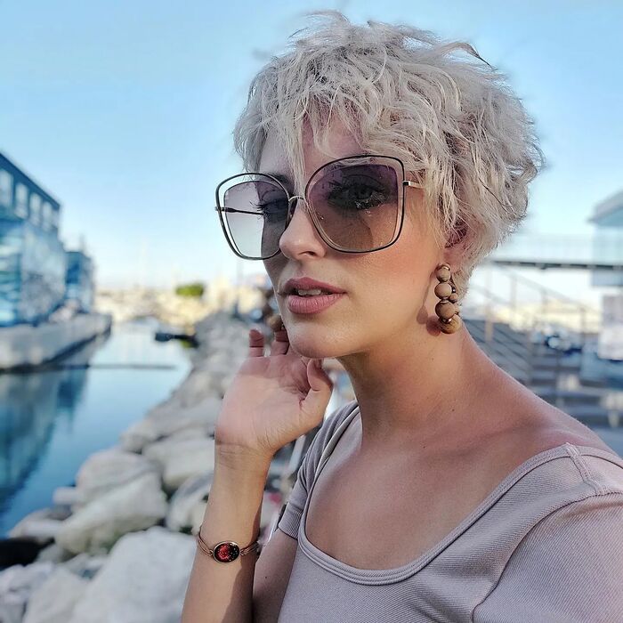 Photo of Woman With Beach Wavy Pixie Bob Haircut